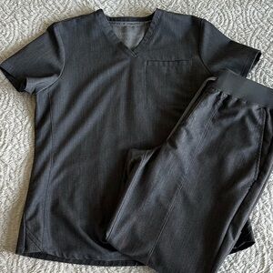 Fabletics scrubs size small (pants are small short). Color is charcoal grey.